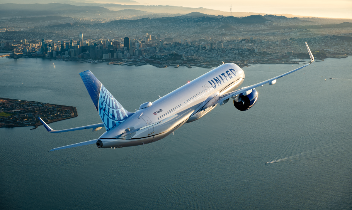 United plane flying over a city